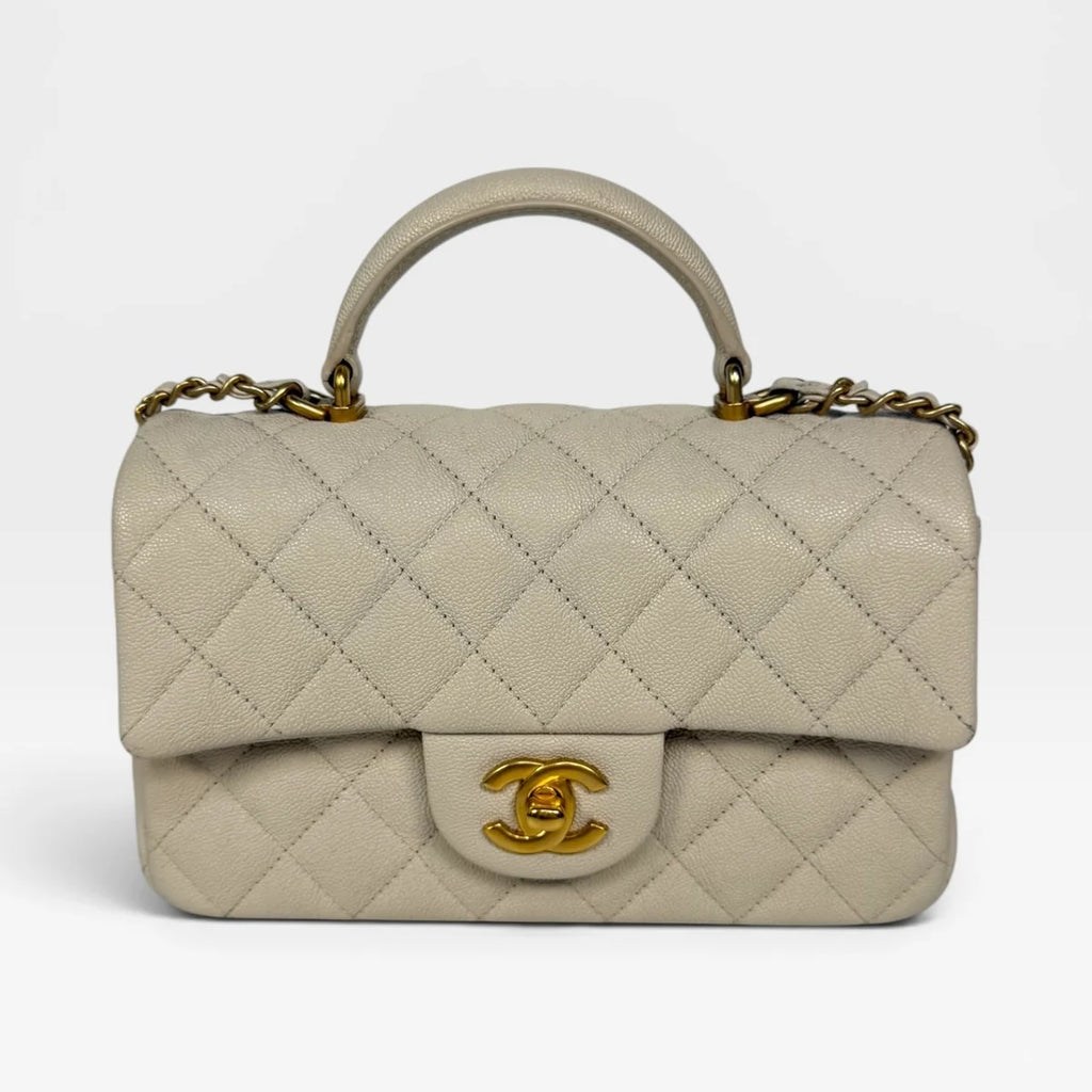 CHANEL MINI RECTANGLE TOP HANDLE IN CREAM CAVIAR LEATHER WITH AGED GOLD HARDWARE