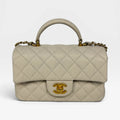 CHANEL MINI RECTANGLE TOP HANDLE IN CREAM CAVIAR LEATHER WITH AGED GOLD HARDWARE